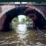 Blurry view of seven bridges over one canal