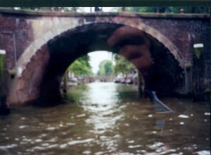 Blurry view of seven bridges over one canal