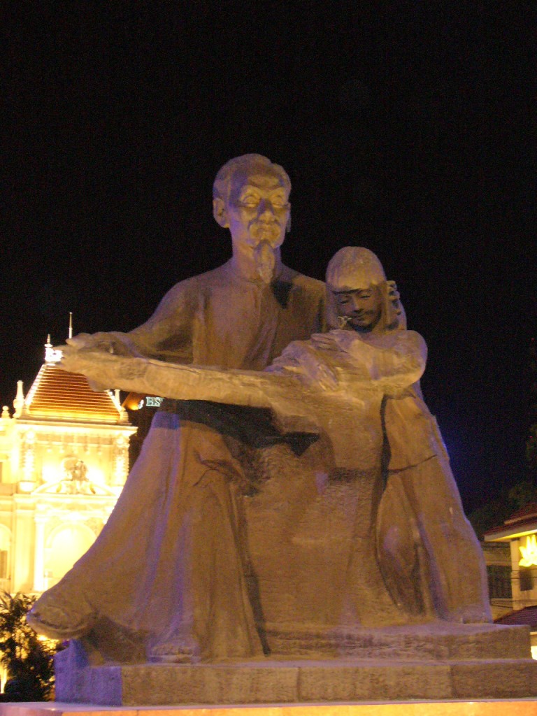 Uncle Ho reading to a boy